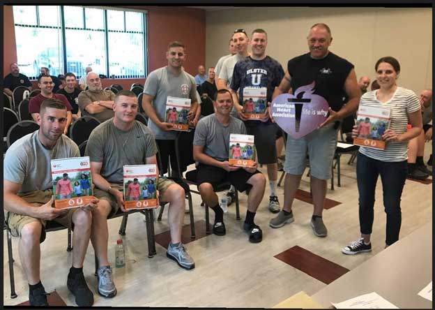 Danielle posing with the fire rescue team