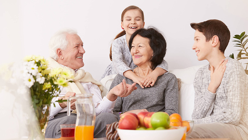 family sitting on couch